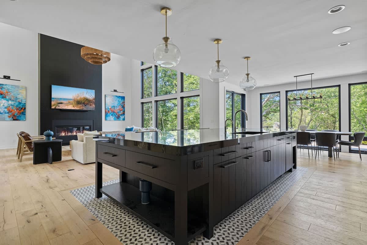 This stunning open kitchen is the ultimate gathering spot, featuring a spacious layout and a magnificent island that's perfect for entertaining.