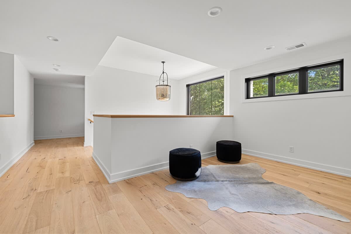 When life feels like a blank canvas, find solace in a white room with hardwood floors and let your imagination run wild.