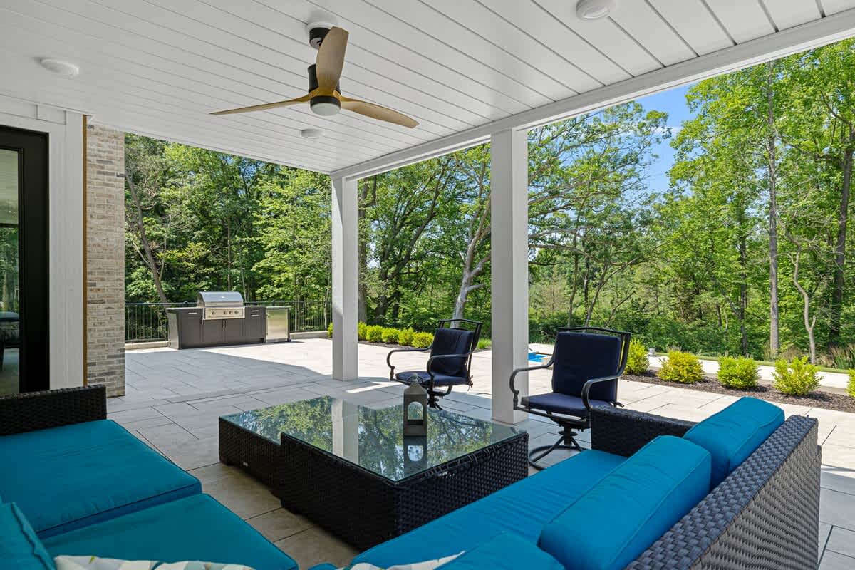 Lounging in style on these chic blue couches under the gentle breeze of the ceiling fan.