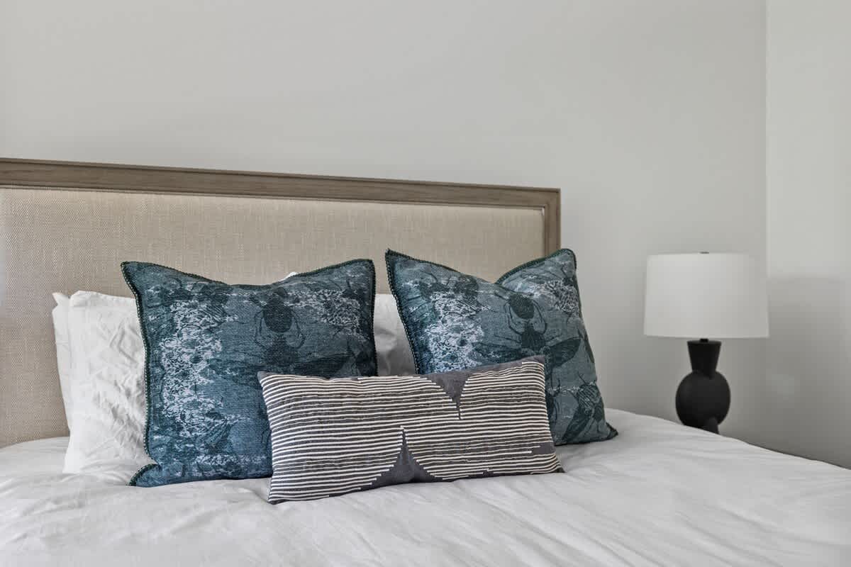 Sweet dreams are made of cozy beds, fluffy pillows, and a nightstand for all your bedtime essentials.