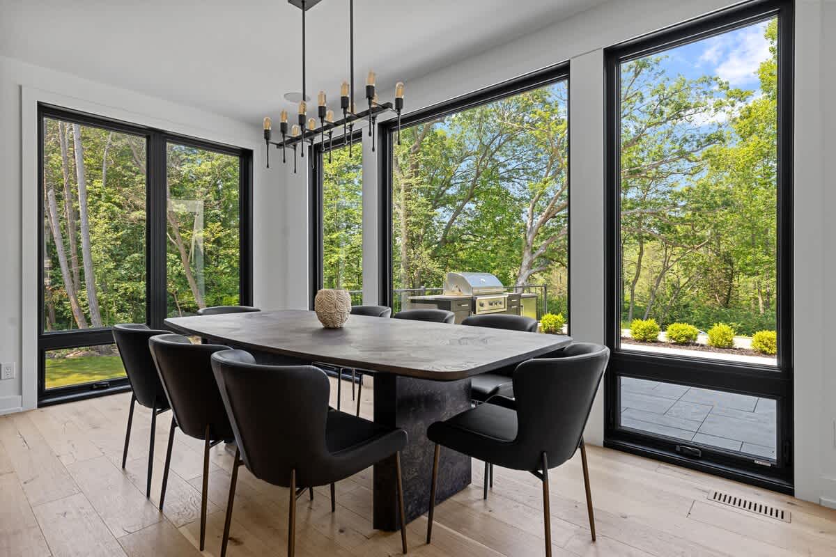 Dining in style with a view! This elegant dining room offers breathtaking vistas while you enjoy a delightful meal.