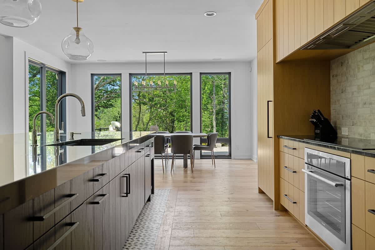 Inviting kitchen with a stunning island and charming wooden floors - the heart of the home.