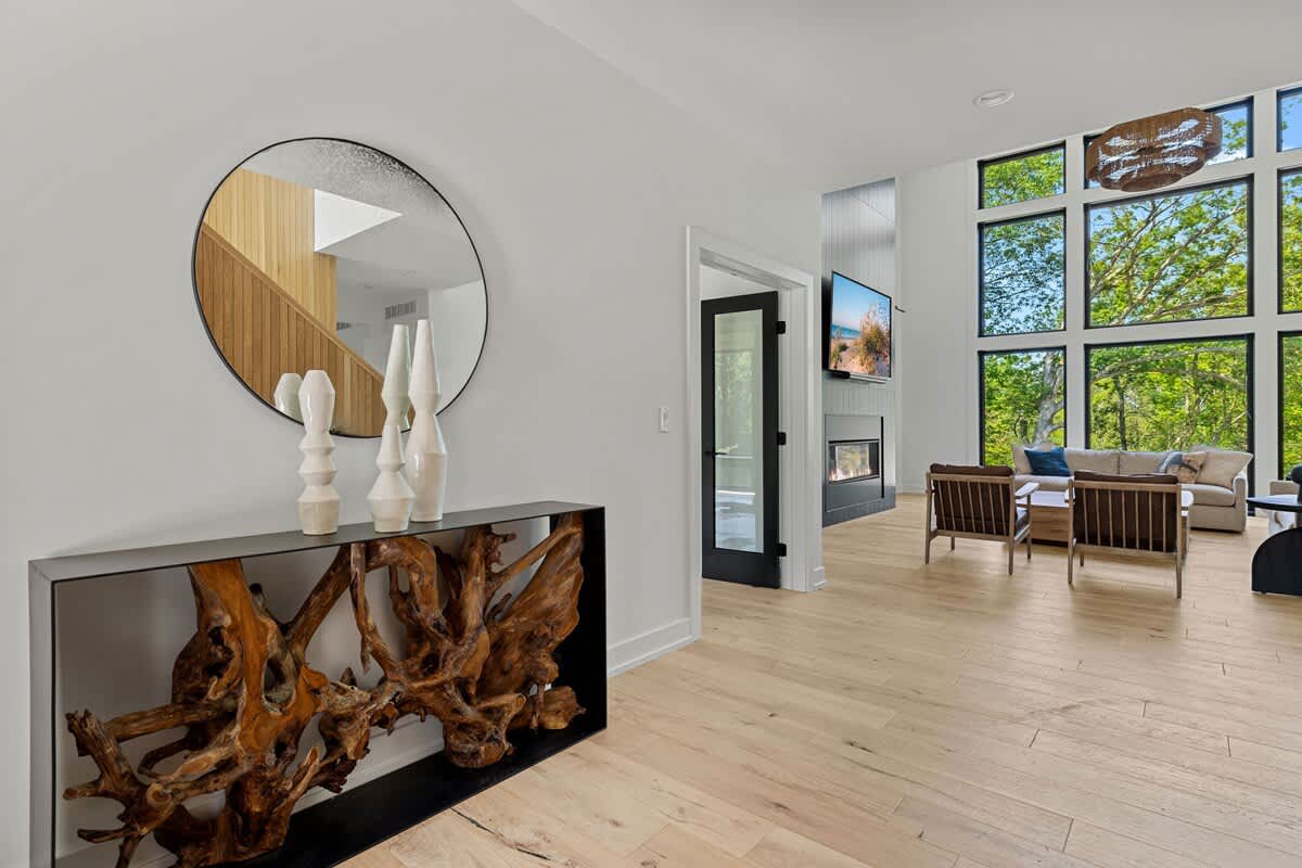 Embracing the beauty of natural light and warm wooden floors in this modern living room.