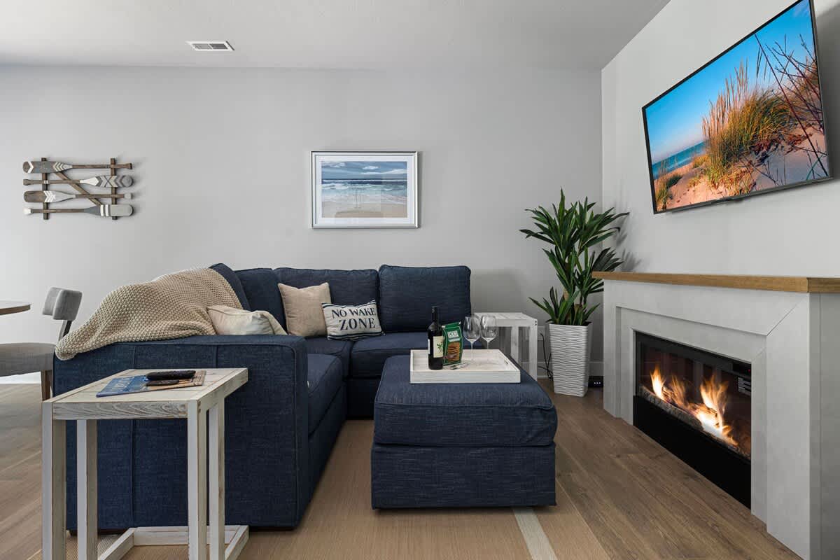 Cozy evenings are made of this: comfy couch, roaring fire, and a 'No Wake Zone' pillow to remind us that relaxation is a must!