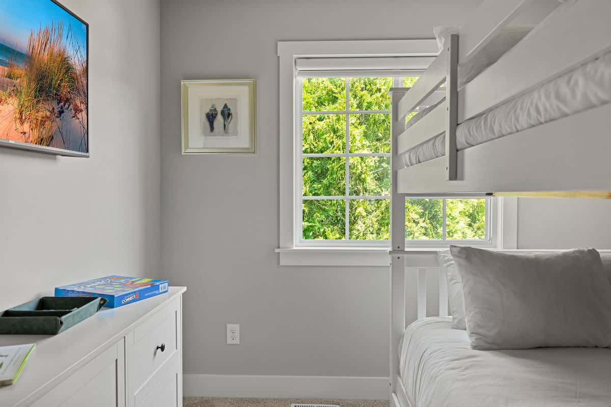 Step into a world of sunshine, cozy bunk beds, and endless board game fun—your perfect playtime haven!
