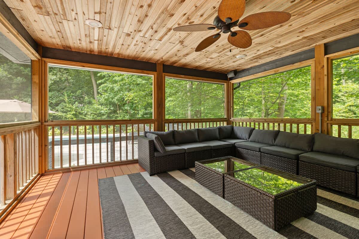 Feel the gentle breeze and listen to the birds while relaxing on this inviting porch.