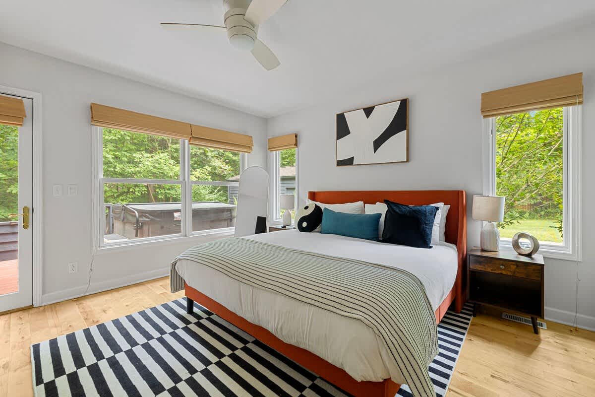 Primary bedroom is on the main level & has a king-size bed.