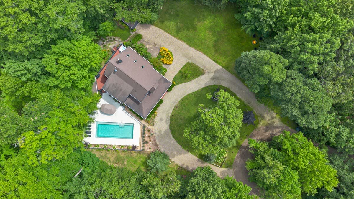 From treetop to poolside, this retreat has it all!