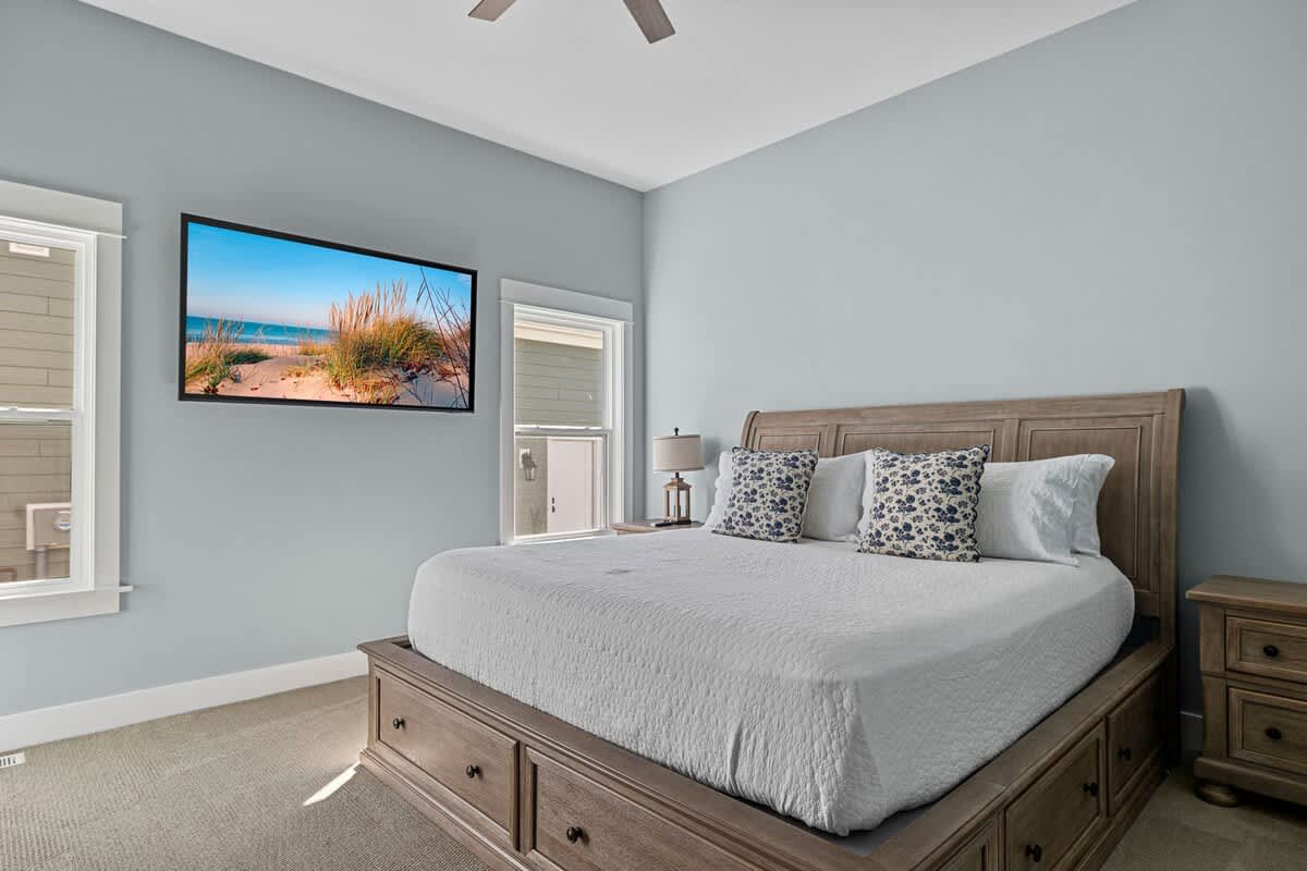 Primary bedroom is on the main level & has a king-size bed.
