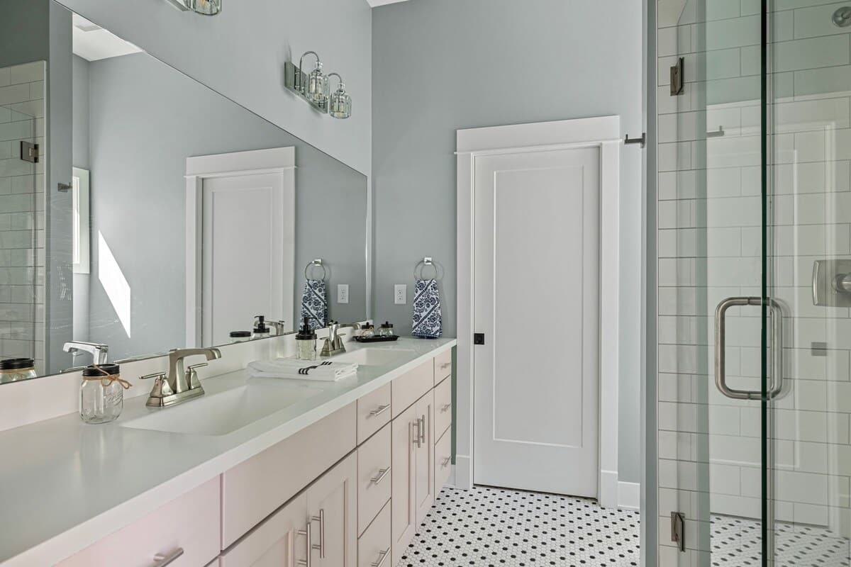 Metro chic styling comes standard, and a tiled walk-in shower and deluxe vanity.