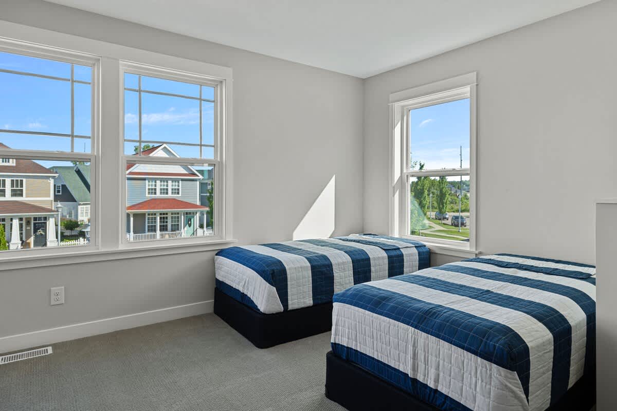 Additional 2 twin-size beds is on the upper floor behind the family room.
