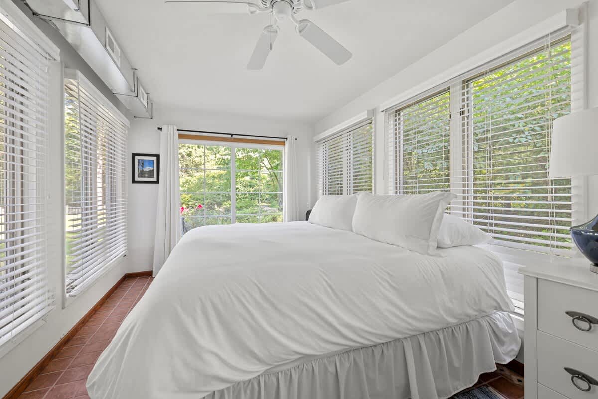 Primary bedroom is on the main level & has a king-size bed.
