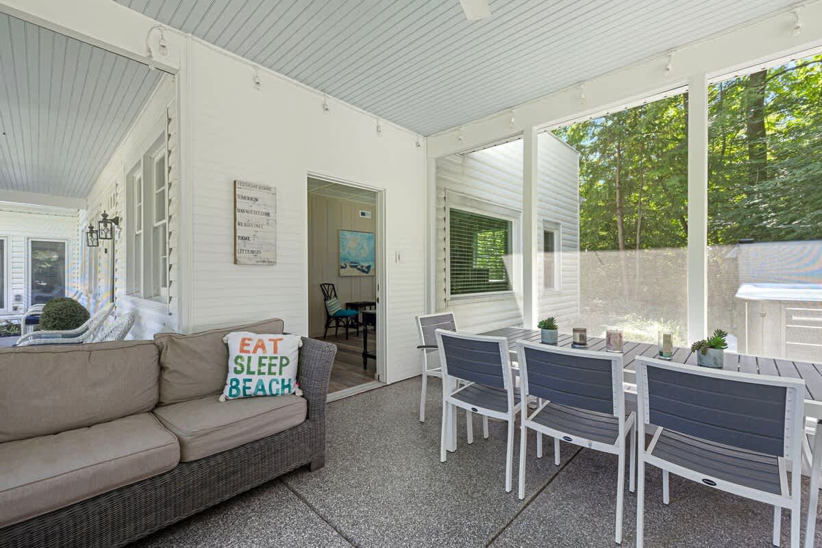 A porch that invites you to dine, lounge, and savor every moment surrounded by nature.