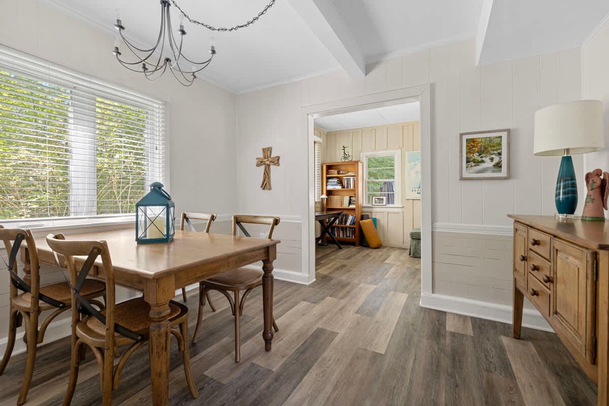 This dining space blends charm and comfort, creating the perfect backdrop for meals that linger long after the last bite.