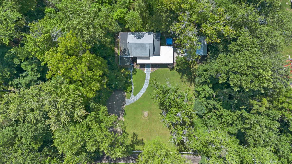 An aerial embrace of nature’s serenity and home’s comfort.