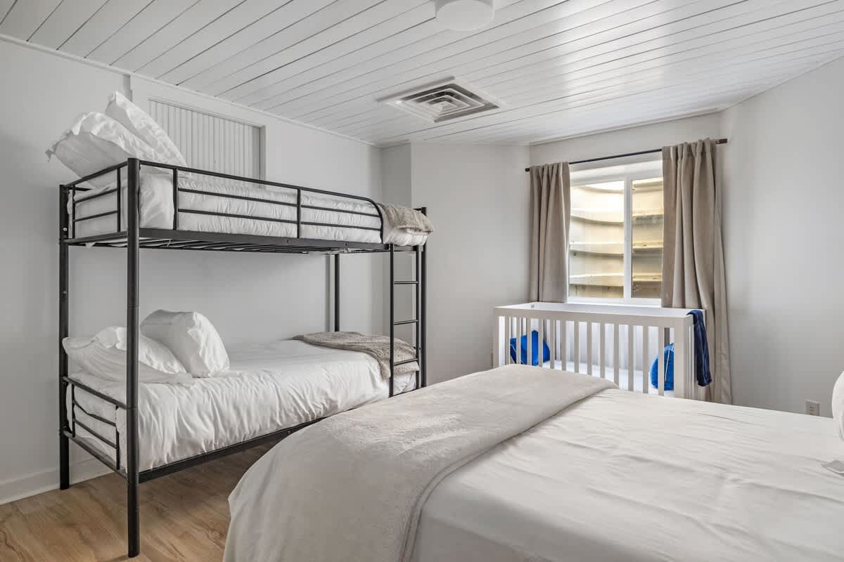 Bedroom 7 is on the lower level & has king-size bed, twin-size bunkbed and a crib.