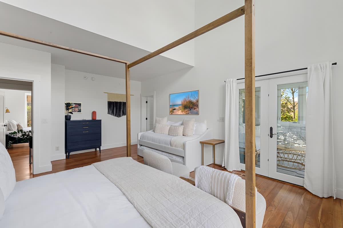 Primary bedroom is on the main level & has king-size bed and 2 twin-size b