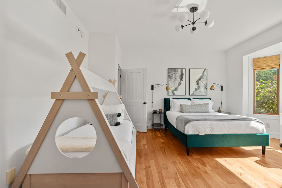 Bedroom 2 is on the main level & has queen-size bed and 2 twin-size beds.