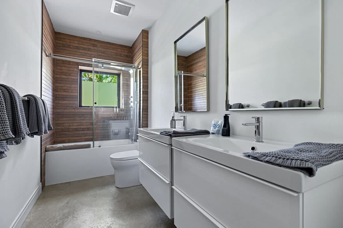 Crisp whites and wood accents—because bathrooms deserve style too.