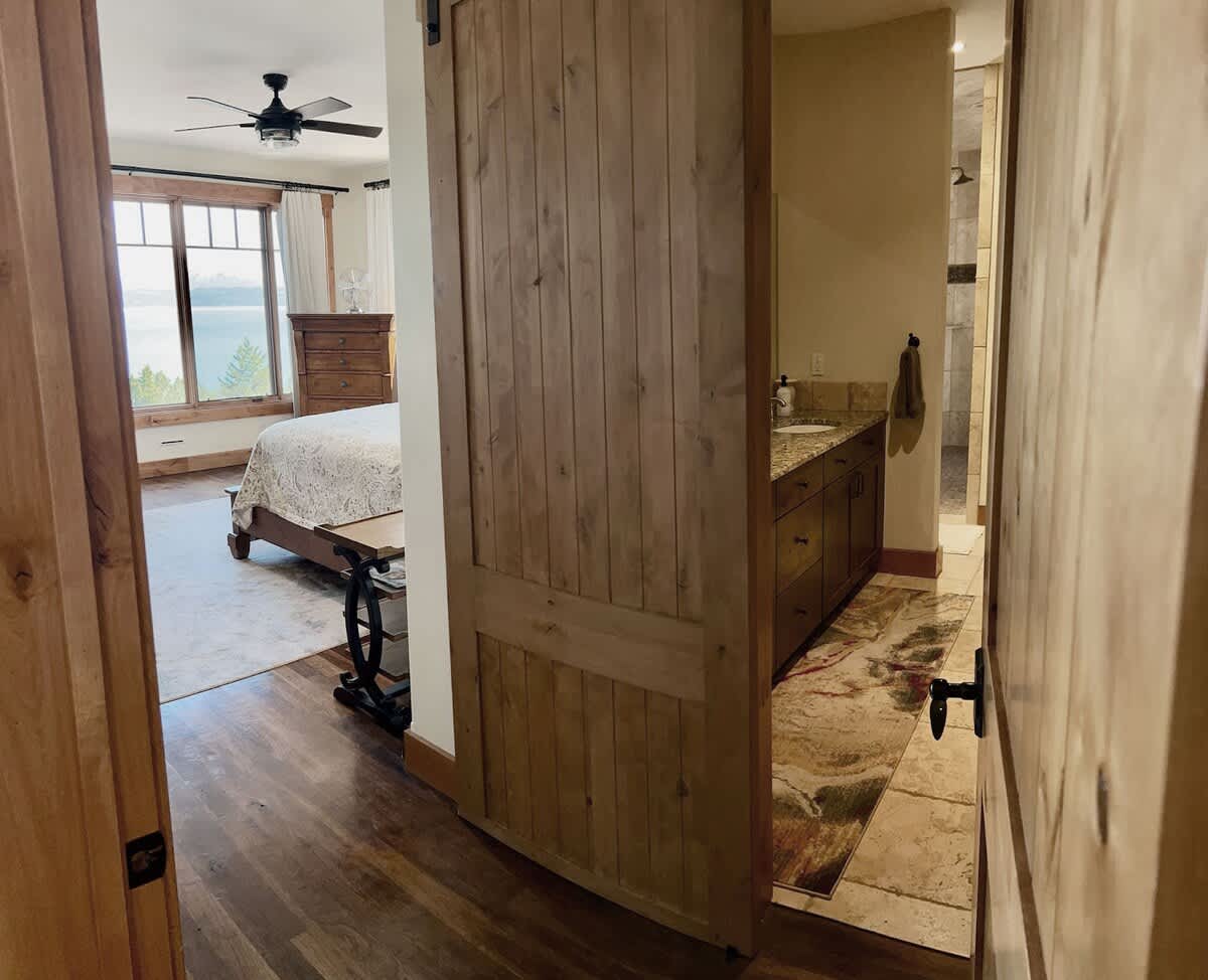 Slide into relaxation—barn doors never looked so chic.