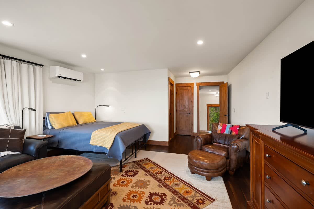 Primary bedroom is on the main level & has a king-size bed.