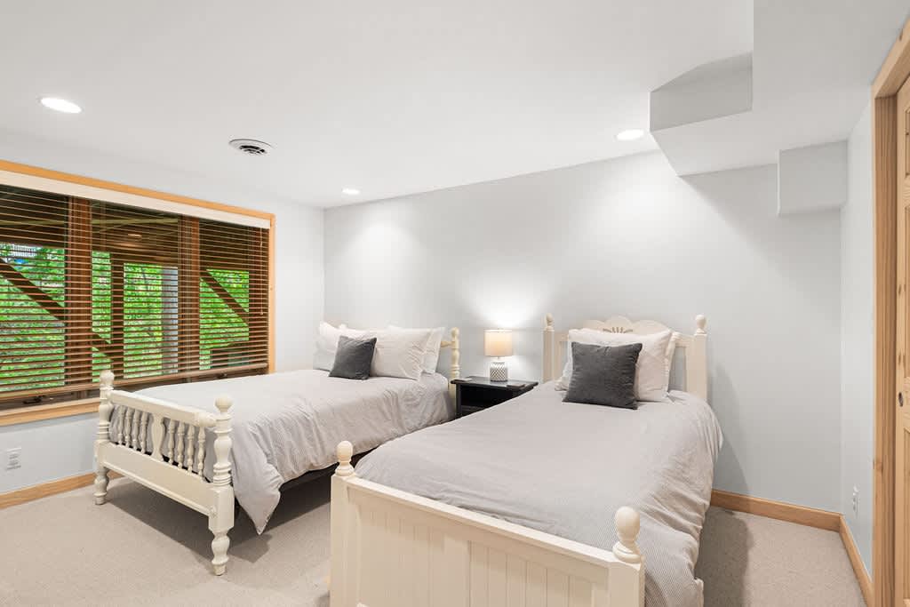 Bedroom 6 is on the lower level & has 1 double and 1 single bed.