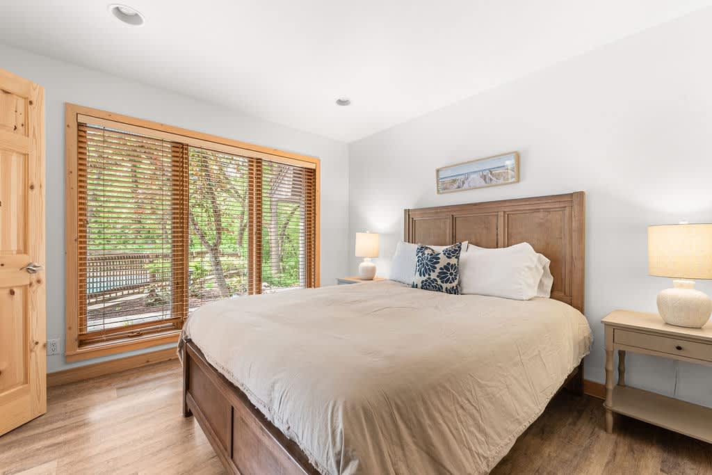 Bedroom 4 is on the main level & has a queen-size bed.