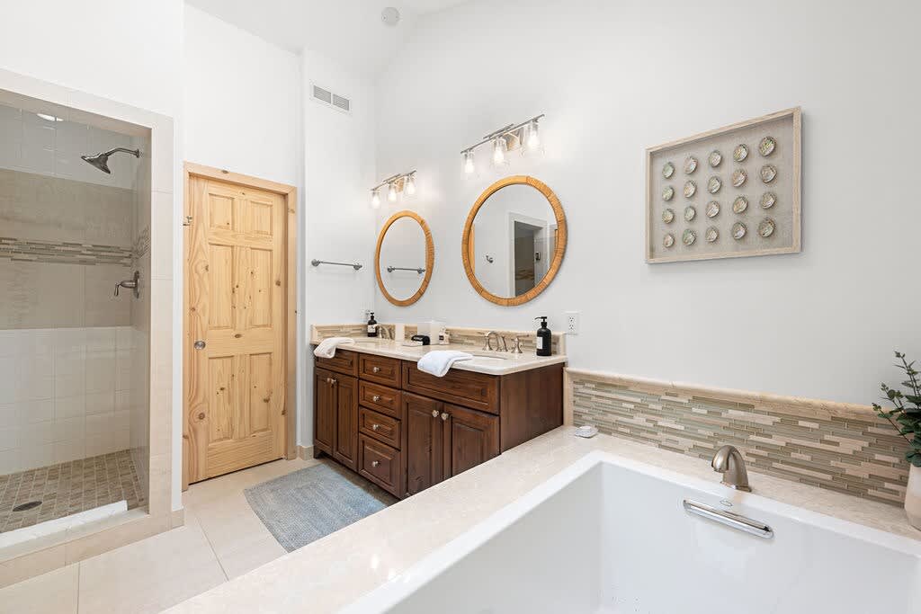 Double vanities, rainfall showers, and serious serenity.