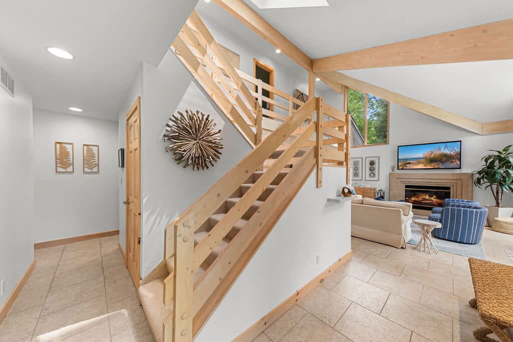 Modern lines, warm woods, and a welcoming first impression.