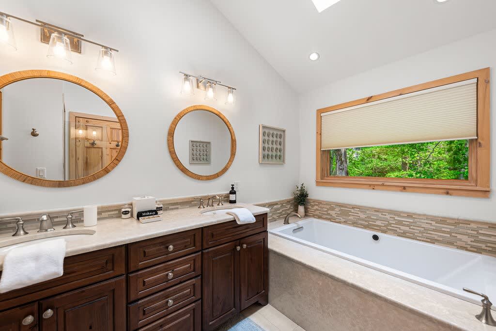 A tub with a view and a vanity built for two.