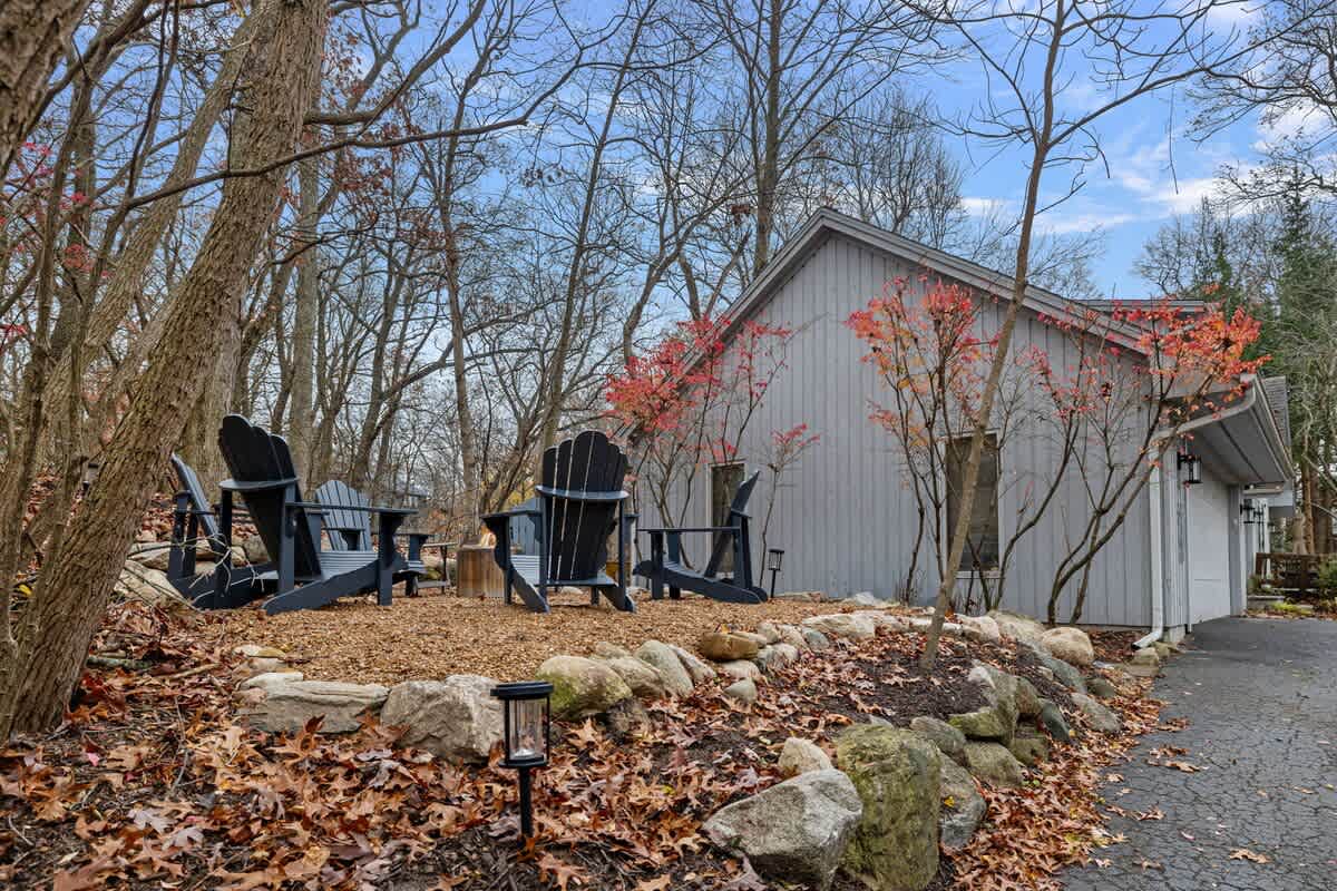 Cozy firepit with woodland views.