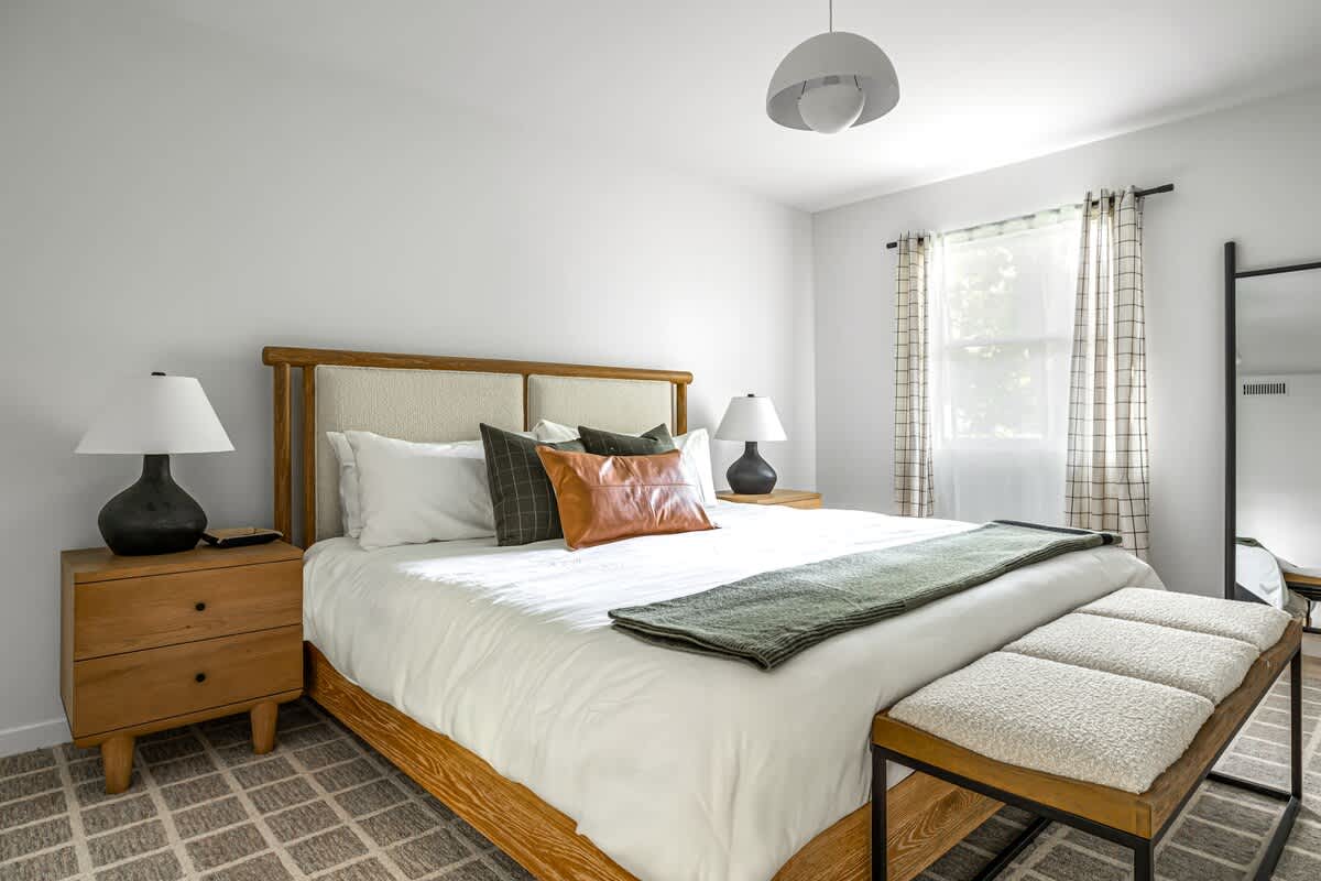 Primary bedroom is on the main level & has a king-size bed.