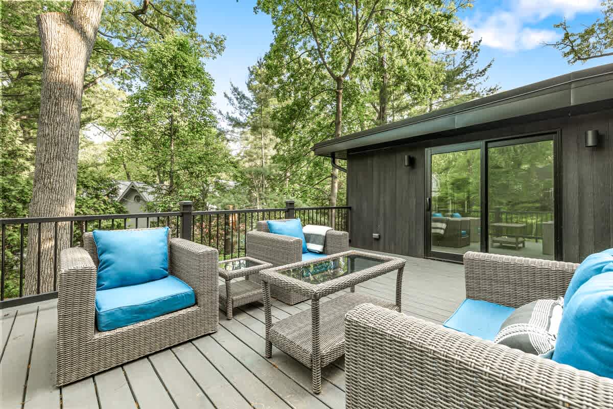 Deck goals: comfy seats + lush views = pure vacation mode.