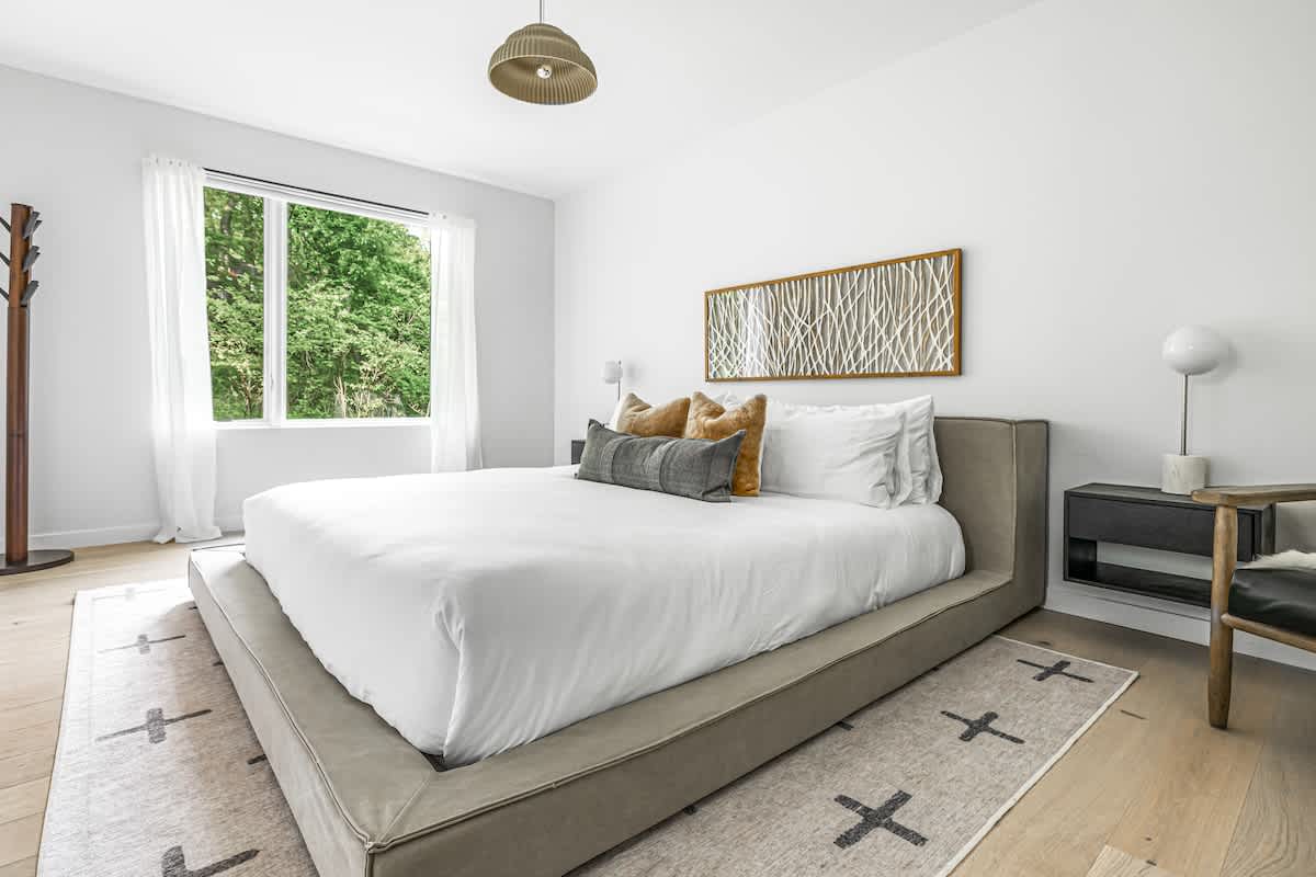 Neutral tones, cozy textures, and a blanket that says, ‘Cuddle up, it’s nap time!’