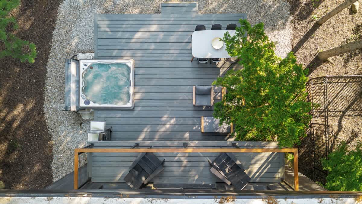 Luxe lounging, bubbling hot tub, and dinner under the trees.