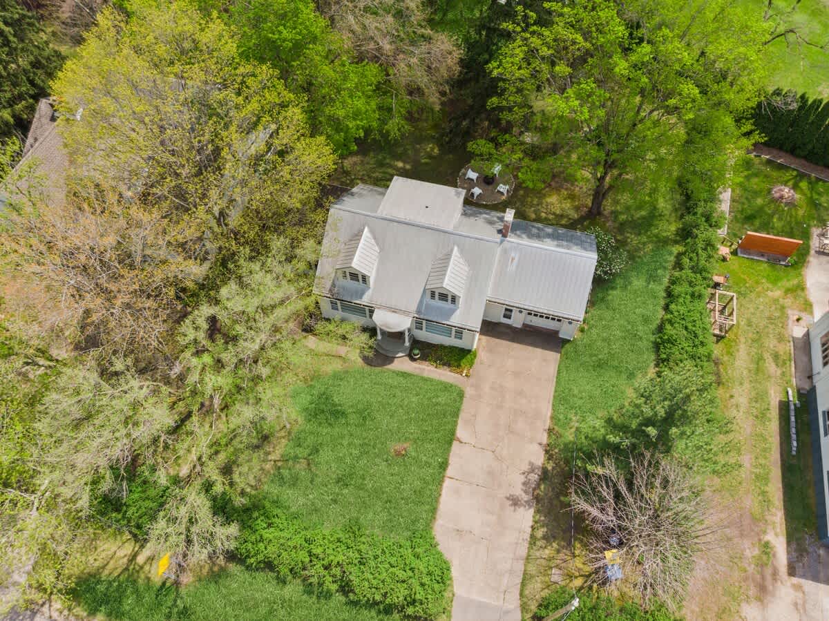 Classic charm and a spacious yard, captured from above.