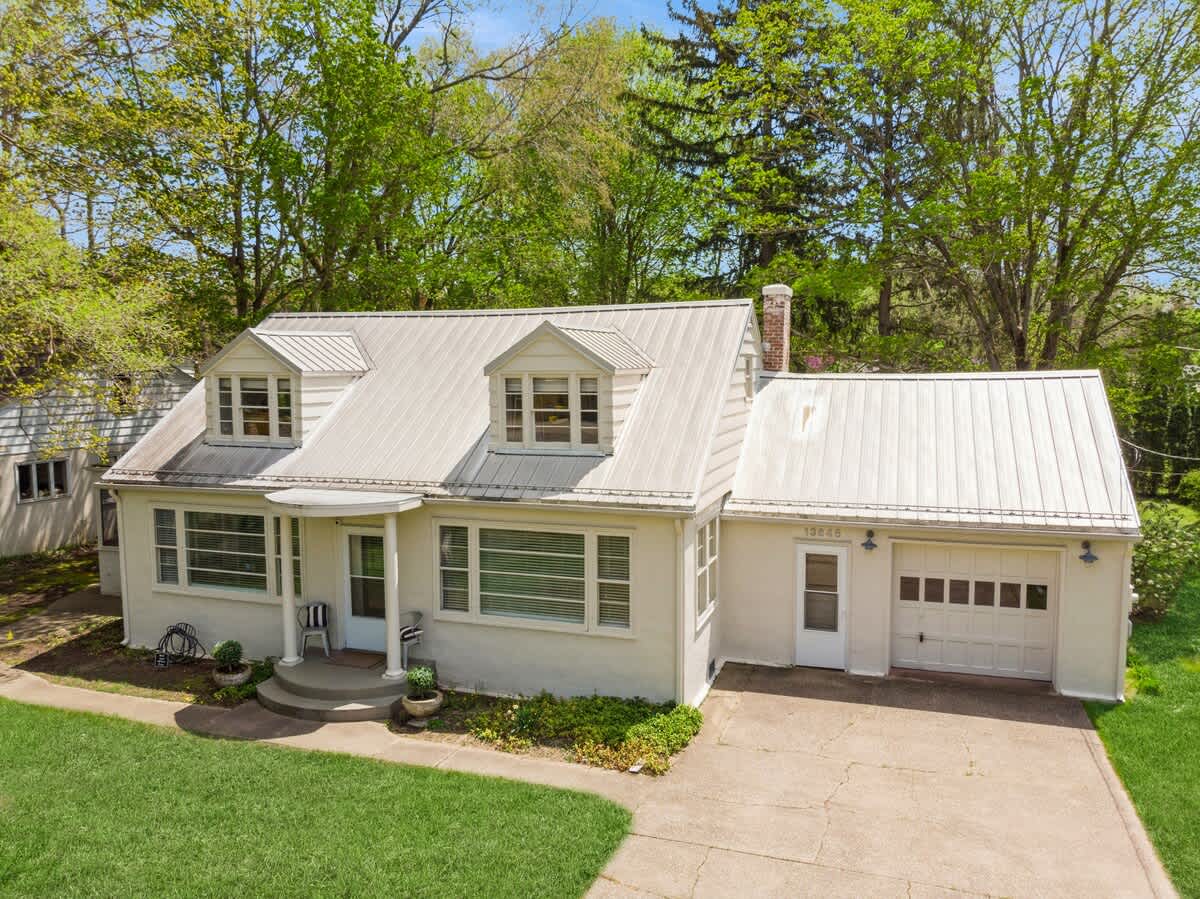 A clean, elegant façade with natural privacy and a welcoming presence.