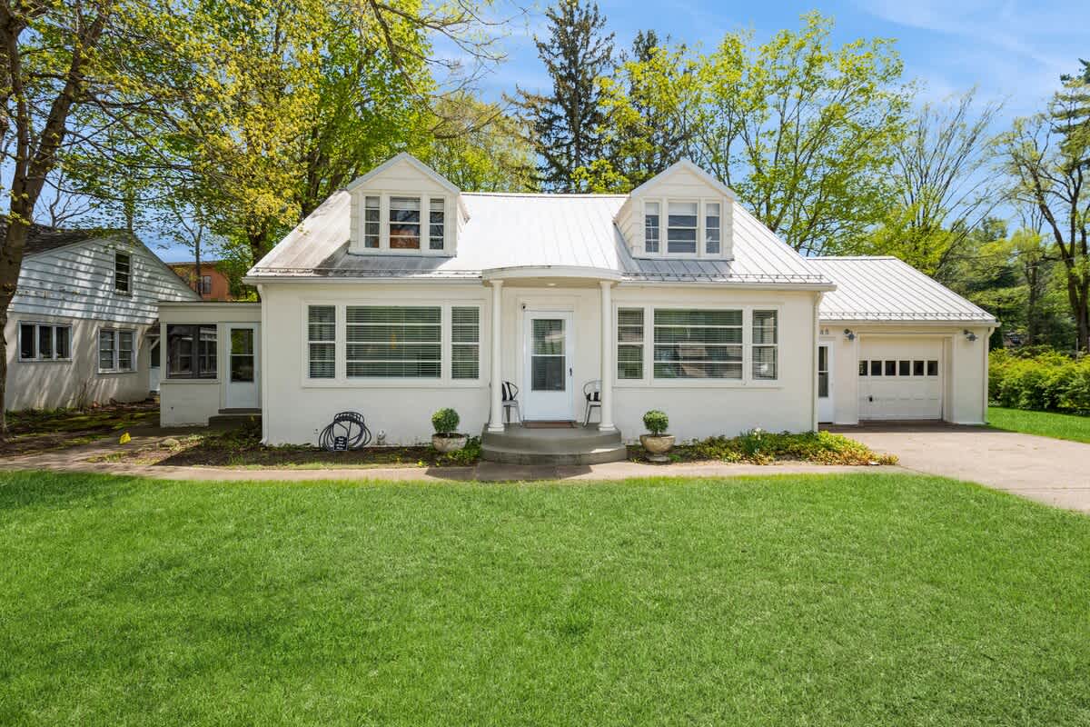 Sunshine, shutters, and the cutest porch for morning coffee.
