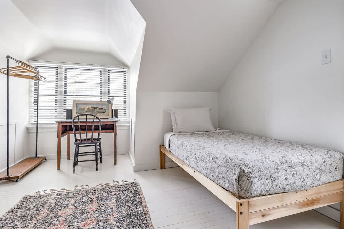 A bed, a desk, and infinite possibilities. Productivity optional, coziness mandatory.