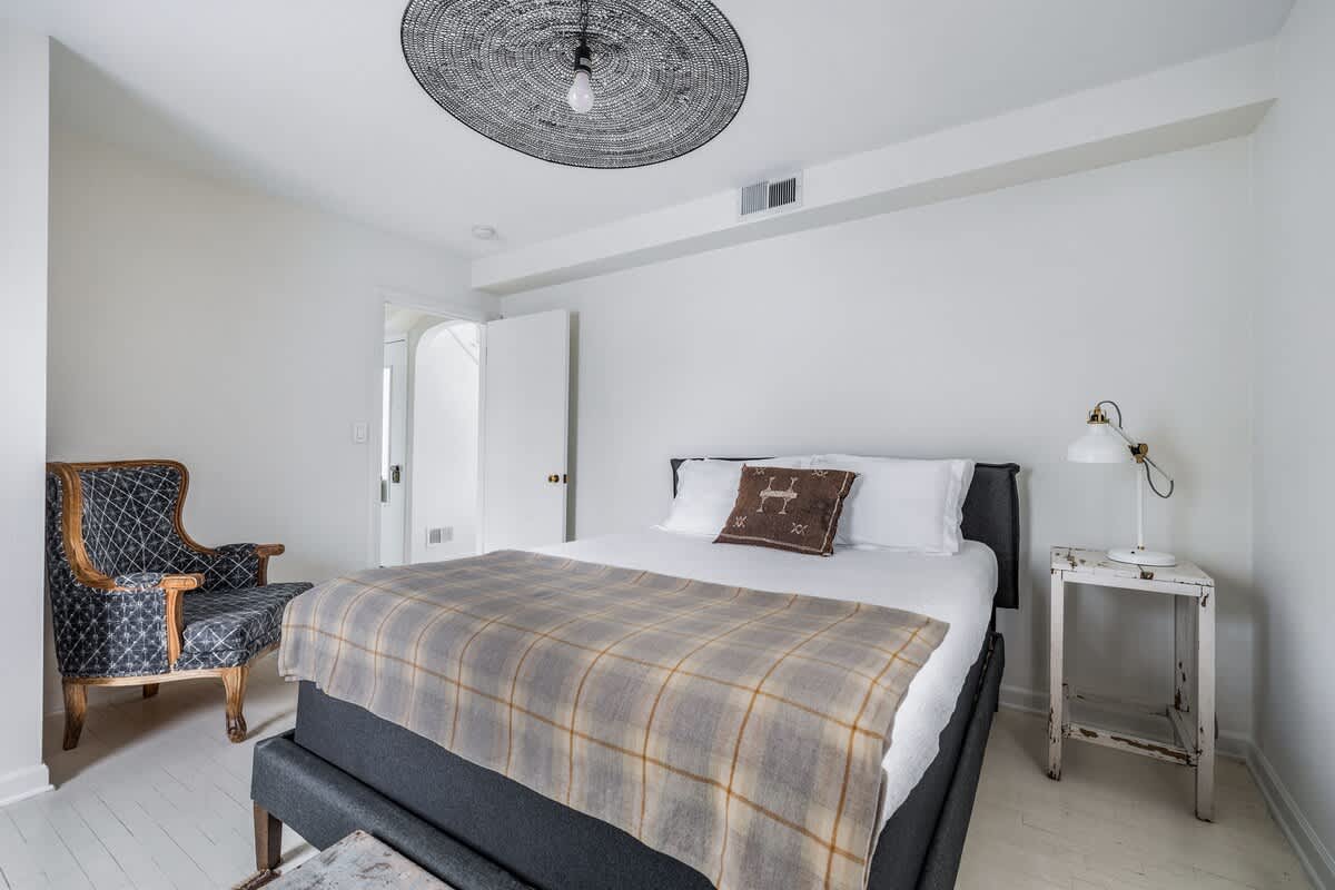 Bedroom 2 is on the main level & has a queen-size bed.