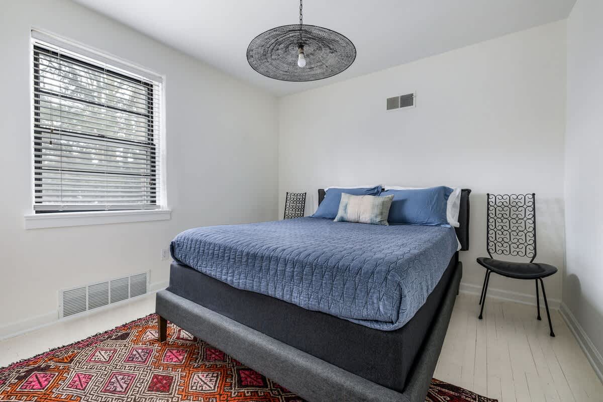 Primary bedroom is on the main level & has a queen-size bed.