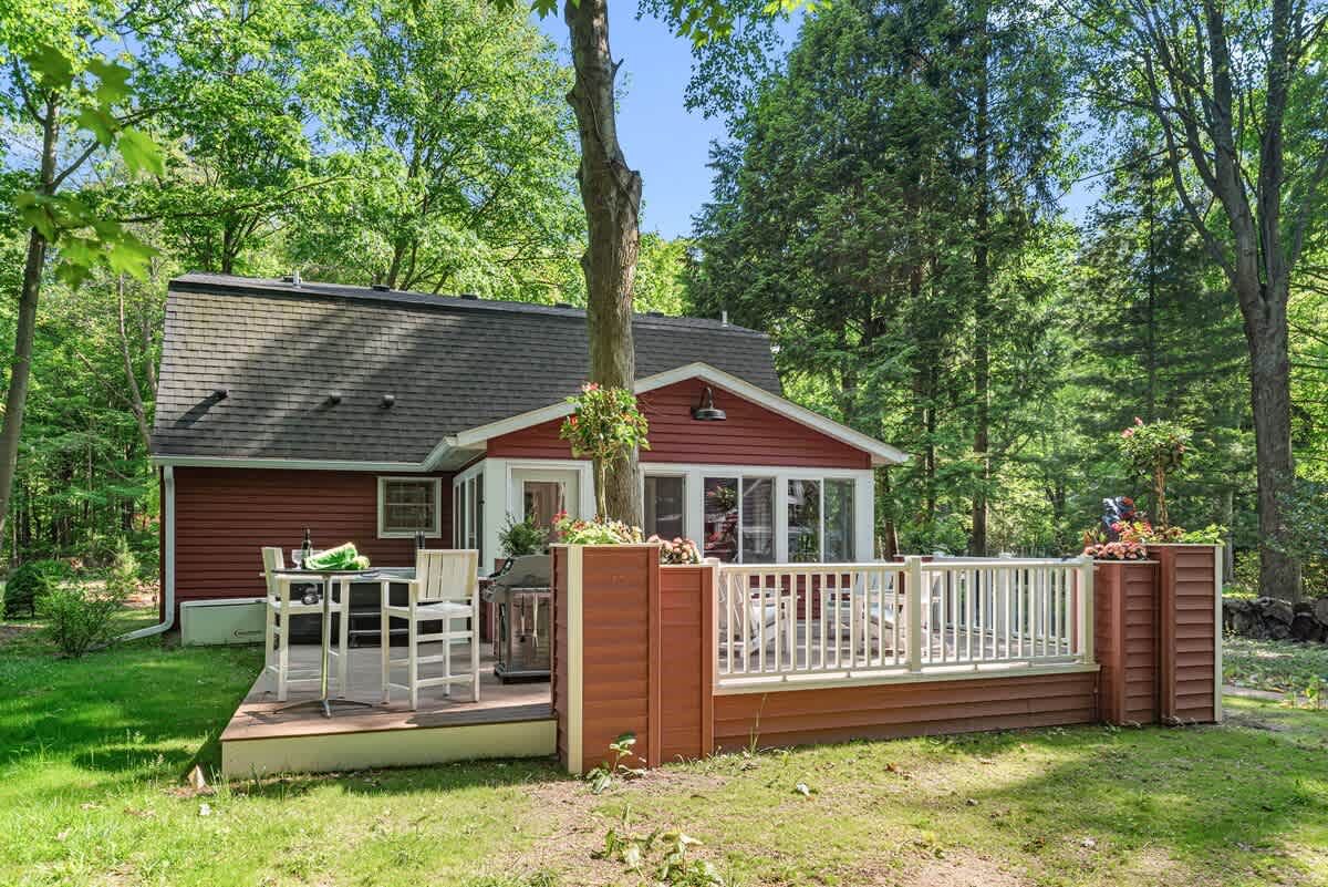 Picture-perfect deck in a peaceful woodland haven.
