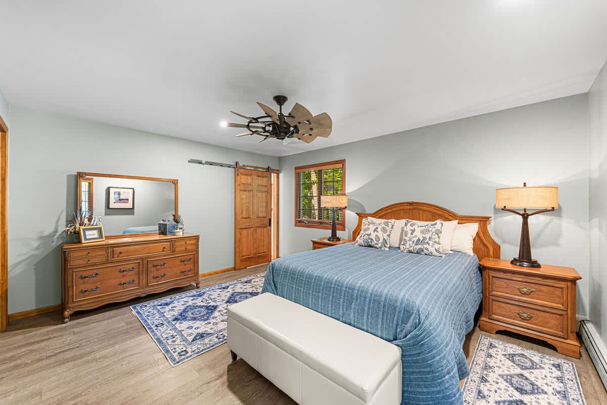 Primary bedroom is on the main level & has a king-size bed.