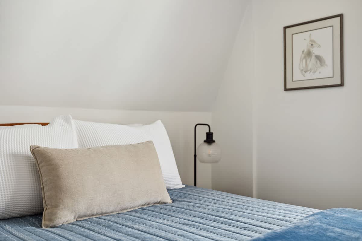 Sink into plush pillows and cozy comfort for a restful stay.