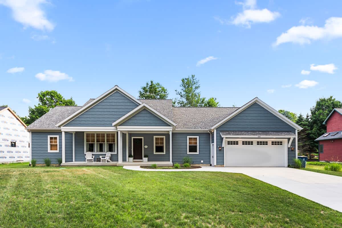 Bright blue skies and a picture-perfect porch - welcome to Blue Hill Cottage!