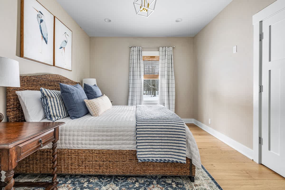 Bedroom 2 is on the main level & has a queen-size bed.