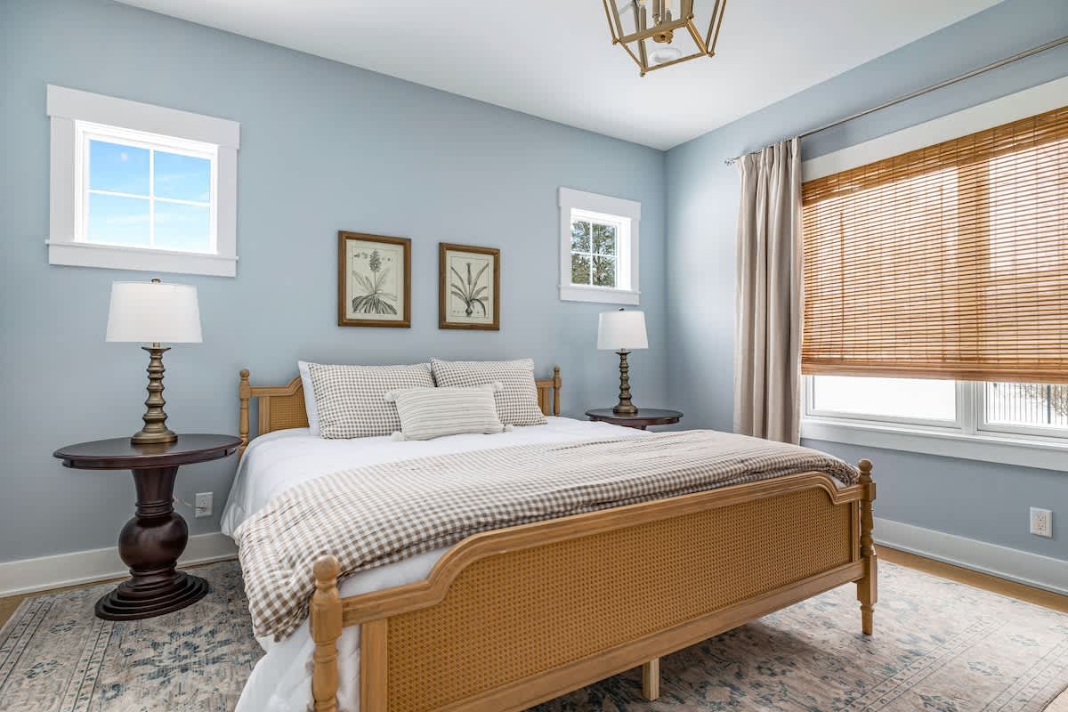 The Primary Bedroom is on the main level & has a king-size bed.