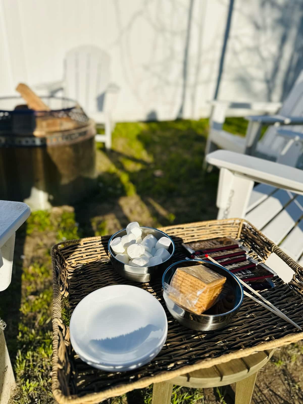 S'mores station is set—graham crackers, chocolate, and marshmallows by the fire pit!