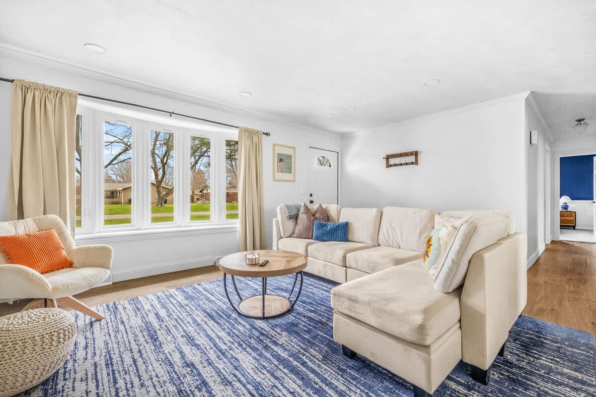 Oh, the sunlit comfort with view. Kick back and enjoy the comfort of this inviting living room.