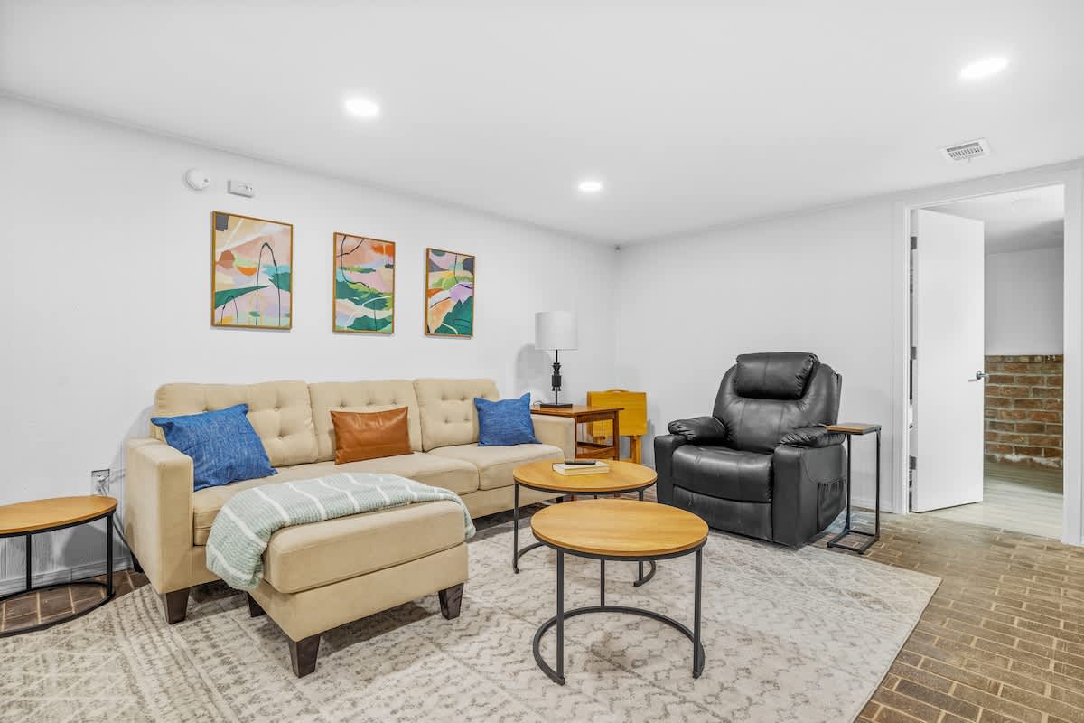 Kick back and relax in this chic living space—perfect for movie nights or lazy mornings.